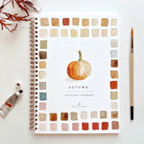 Autumn-themed watercolor workbook with a pumpkin illustration
