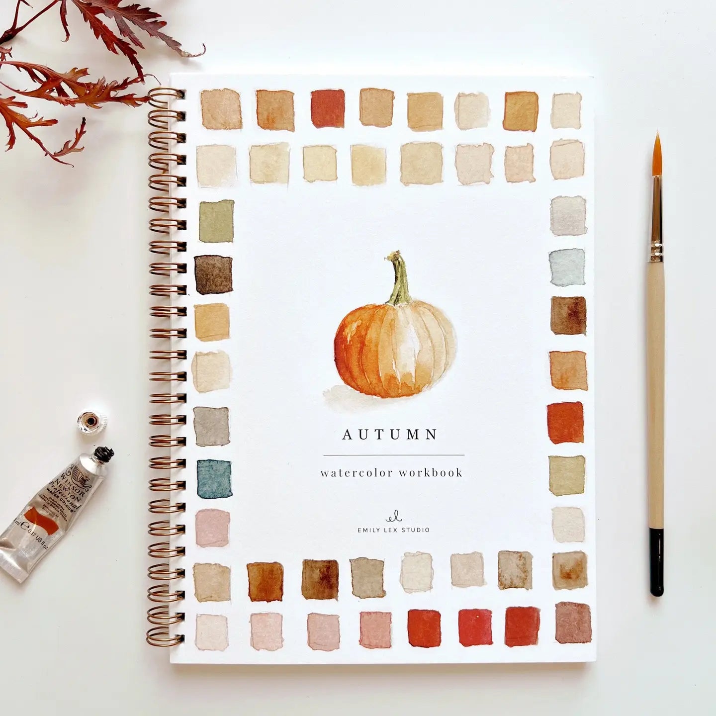 Autumn-themed watercolor workbook with a pumpkin illustration