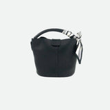 Black handbag with a decorative ribbon