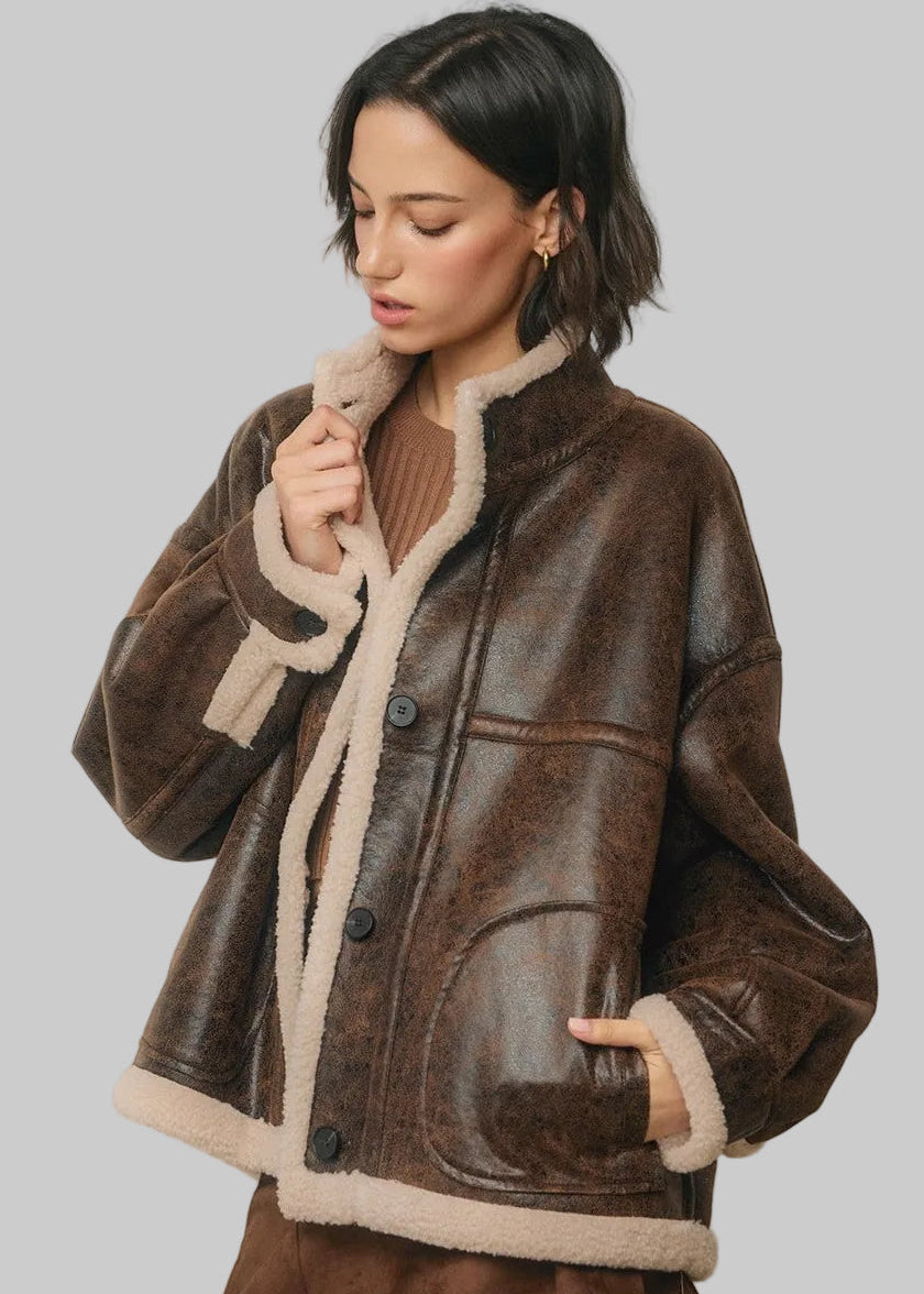 Brown faux leather sherpa jacket with cream collar, cuffs and hem