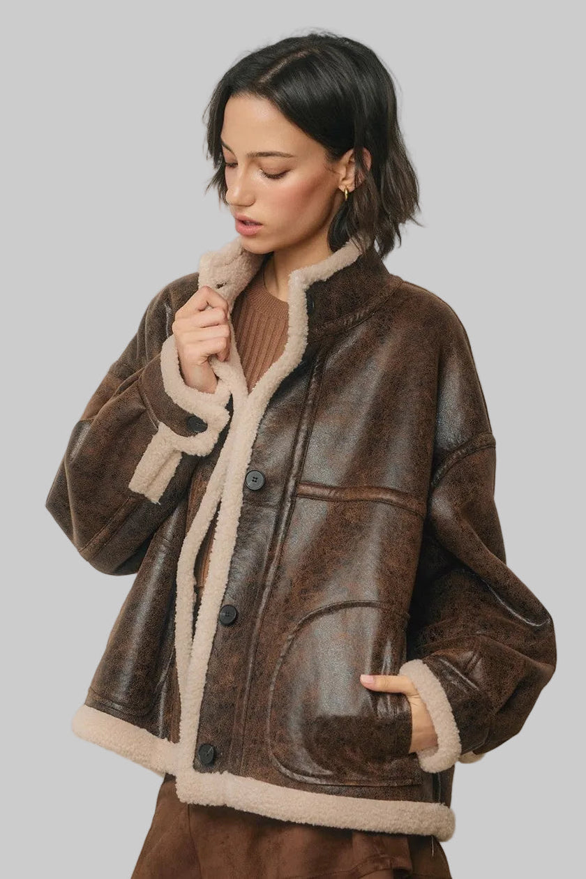 Brown faux leather sherpa jacket with cream collar, cuffs and hem