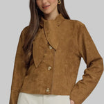 Woman wearing a camel brown suede-look jacket with scarf-tie neckline, button front