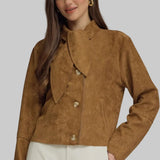 Woman wearing a camel brown suede-look jacket with scarf-tie neckline, button front