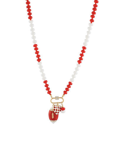 Necklace with red and white beads and a football charm on a white background