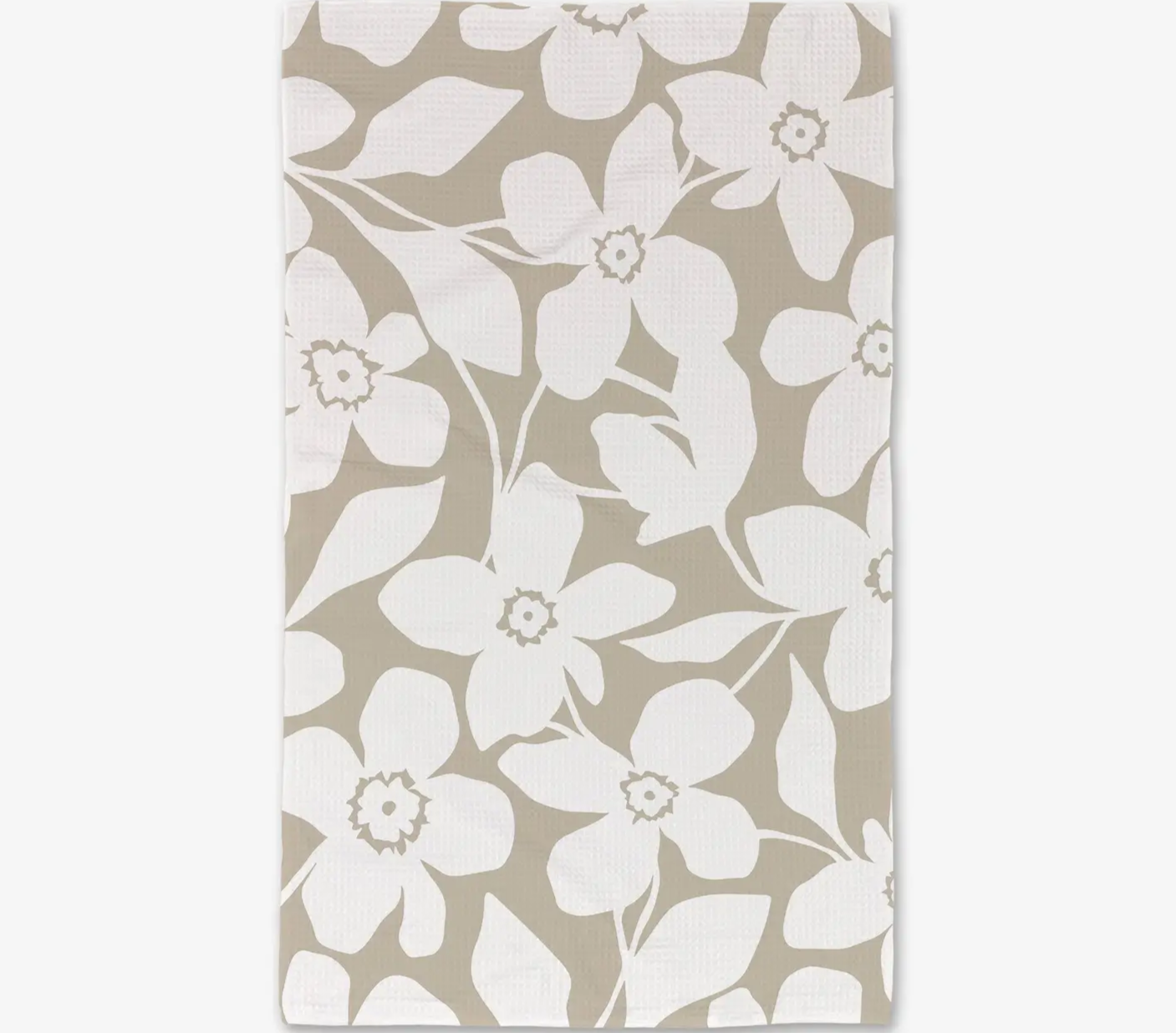 A hand towel with a floral pattern in tan and white colors.