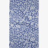 A blue floral patterned tea towel