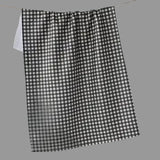 A black and white gingham checkered towel