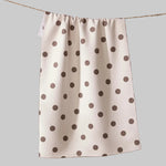 White towel with brown polka dots