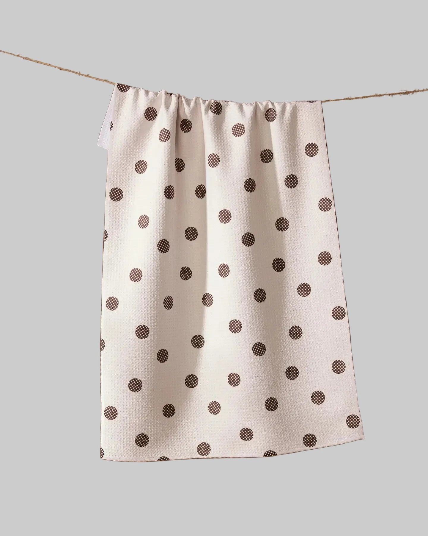 White towel with brown polka dots