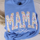 Light Blue sweatshirt with floral lettering spelling MAMA