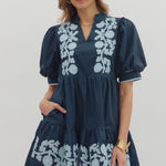 Short sleeved, baby doll navy dress with lt. blue floral appliques