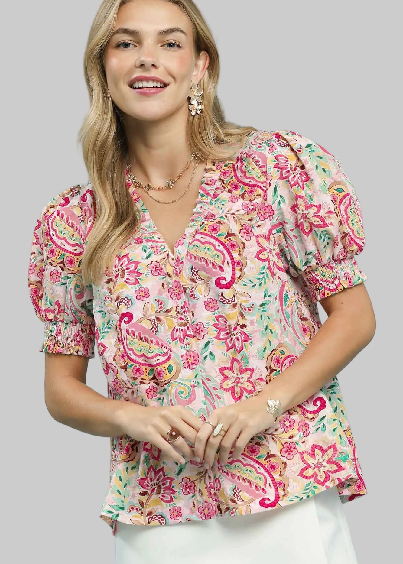Short sleeved, button front pink floral and paisley print top.