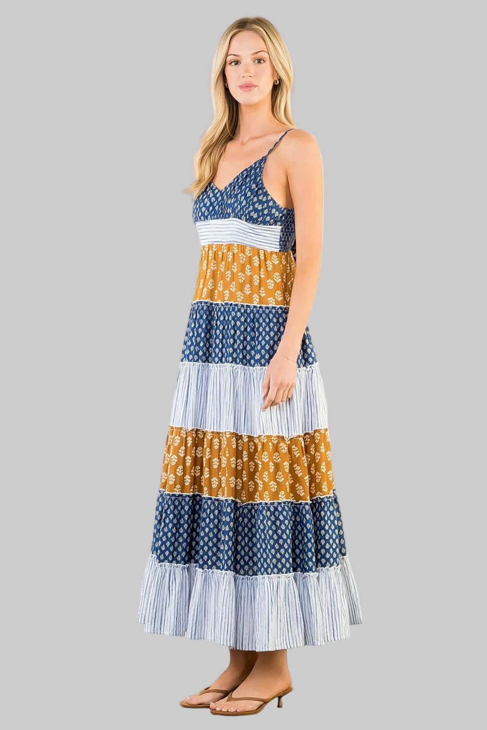 patterned dress with blue, yellow, and white colors