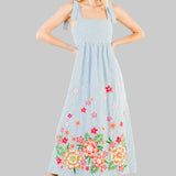 light blue stripe dress with floral embroidery on the hem