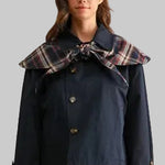 Navy women's jacket with plaid tie collar and plaid cuff details