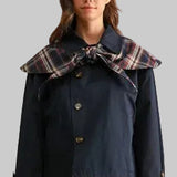 Navy women's jacket with plaid tie collar and plaid cuff details