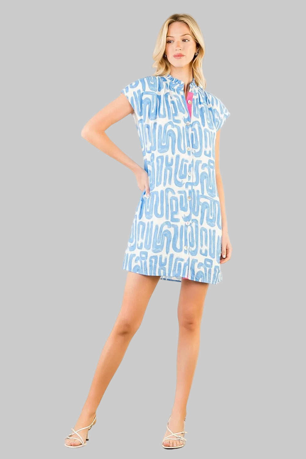 short-sleeve mini dress with a light blue and white abstract pattern, featuring a pink collar detail