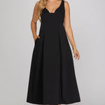 sleeveless black midi dress with a V-neckline and pleated skirt