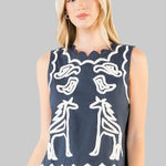 sleeveless navy top with white embroidery